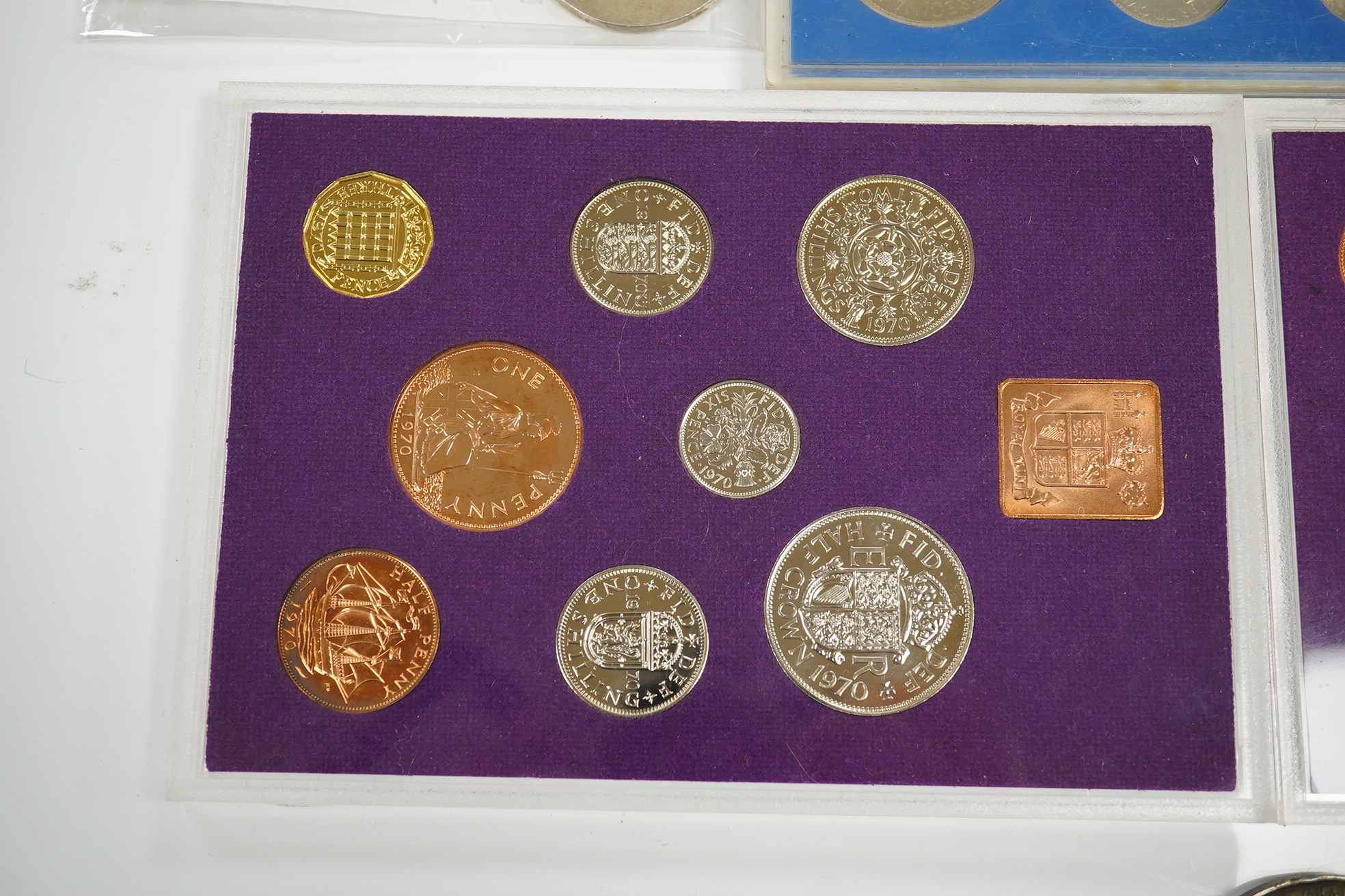 A small collection of coins including two 1970 proof sets, a 1953 set, a George III crown, a 1933 George V crown and a medallion for the Argyle Chapel, Bath. Condition - fair